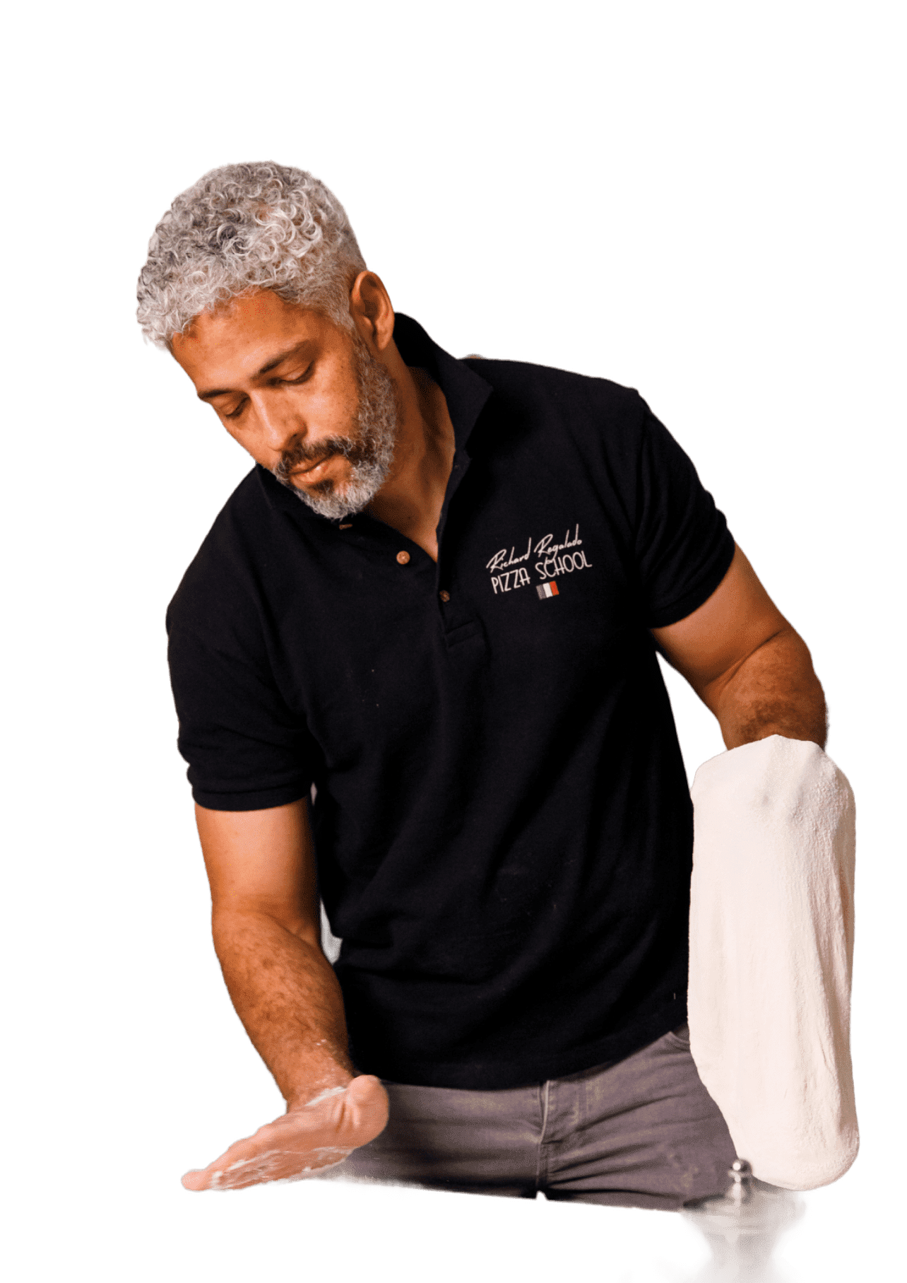 Richard Regalado preparing pizza dough